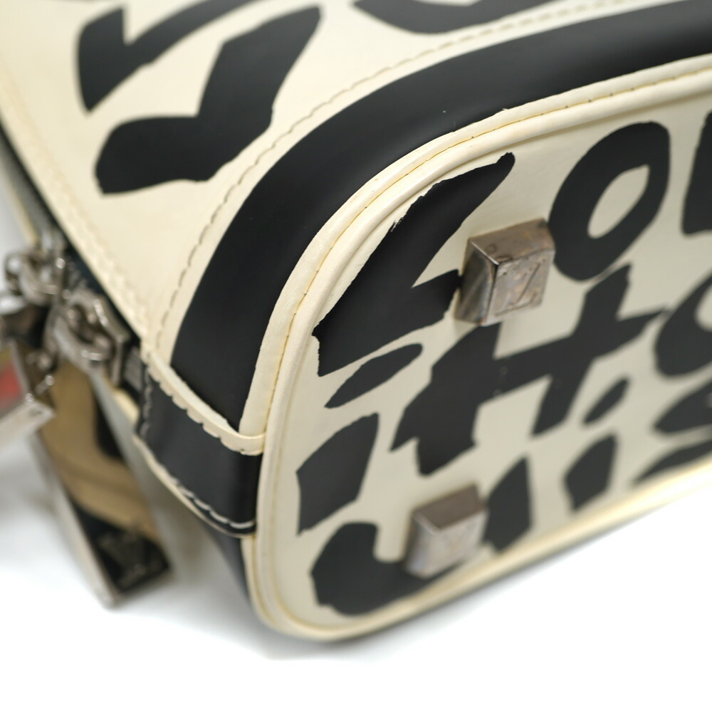 Louis Vuitton Alma Black White Bag - Picture 5 of 9